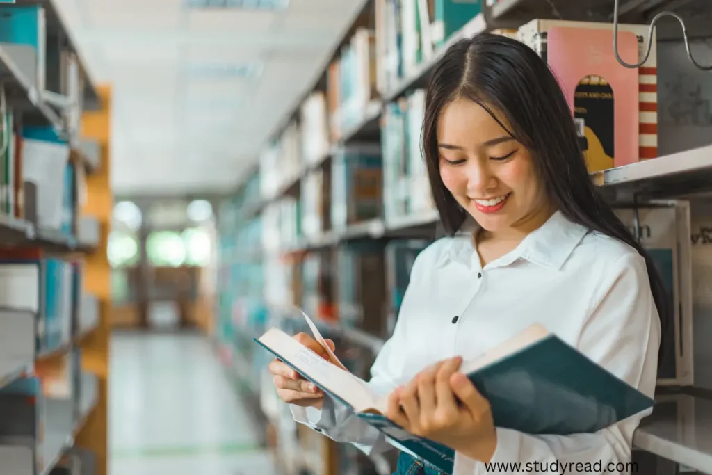Woman in library reading a book