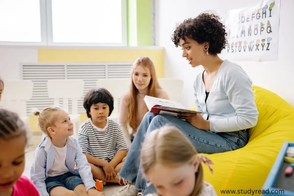 Teacher teaching kids from a book